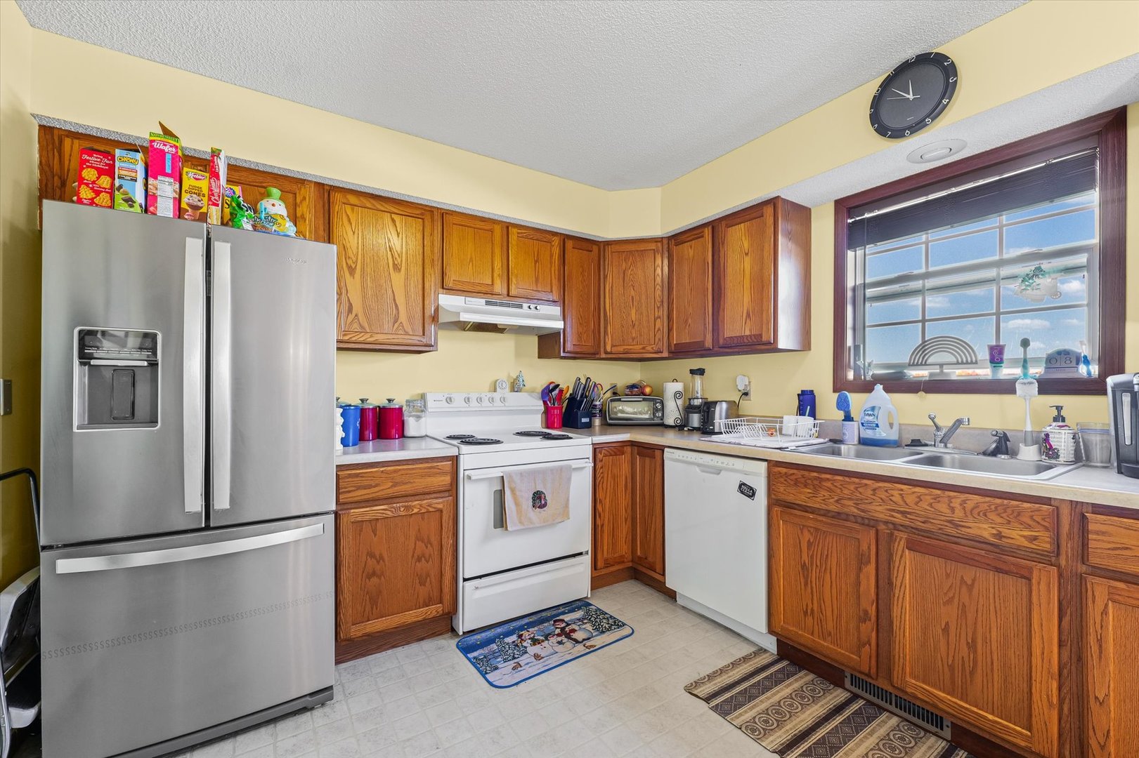 707 Country View Drive Philo, IL 61864 - Photo 9 of 28 a kitchen with stainless steel appliances granite countertop a refrigerator sink and cabinets