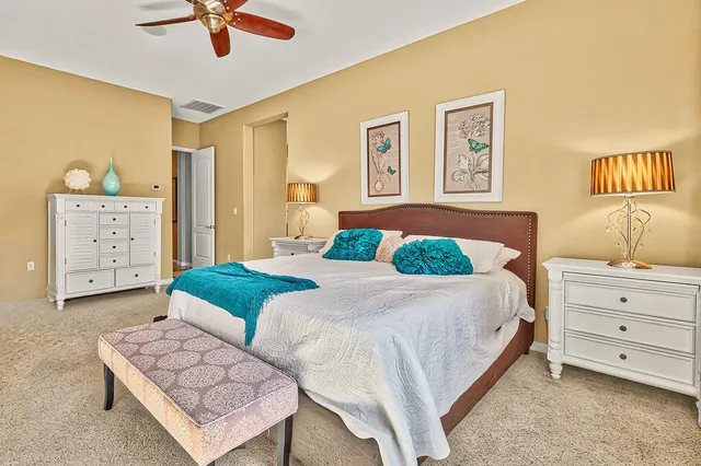 a bedroom with a bed and a dresser