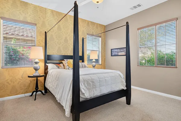 a bed room with a bed and a window