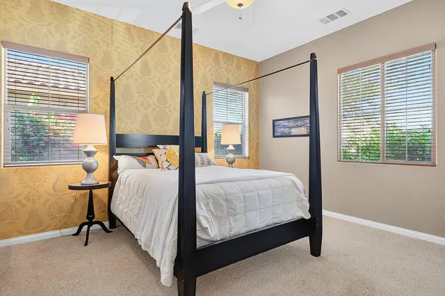 a bed room with a bed and a window