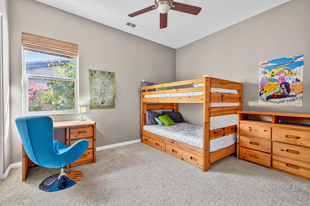 35831 Raphael Drive Palm Desert, CA 92211 - Photo 18 of 24 a bedroom with furniture and a window