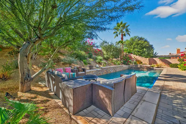 a view of a couches and table in the patio