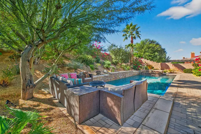 a view of a couches and table in the patio