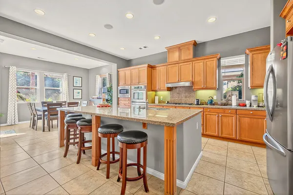 a kitchen with a sink a counter top space and appliances