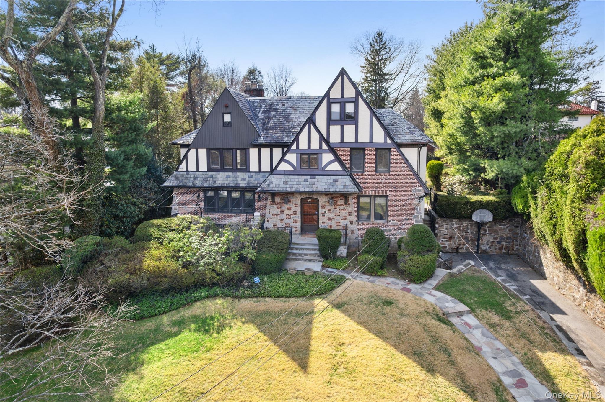 44 Fenimore Road New Rochelle, NY 10804 - Photo 2 of 46 a front view of a house with a yard