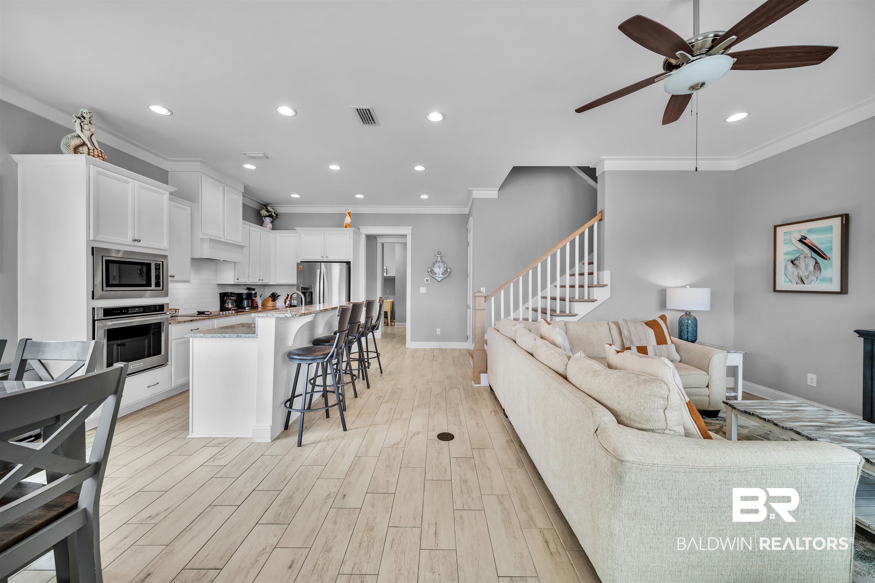 47 Parks Edge Orange Beach, AL 36561 - Photo 16 of 40 Living area with ornamental molding, a ceiling fan, recessed lighting, light wood-type flooring, and stairway