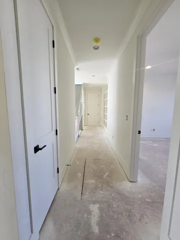 an empty room with a empty space and a ceiling fan