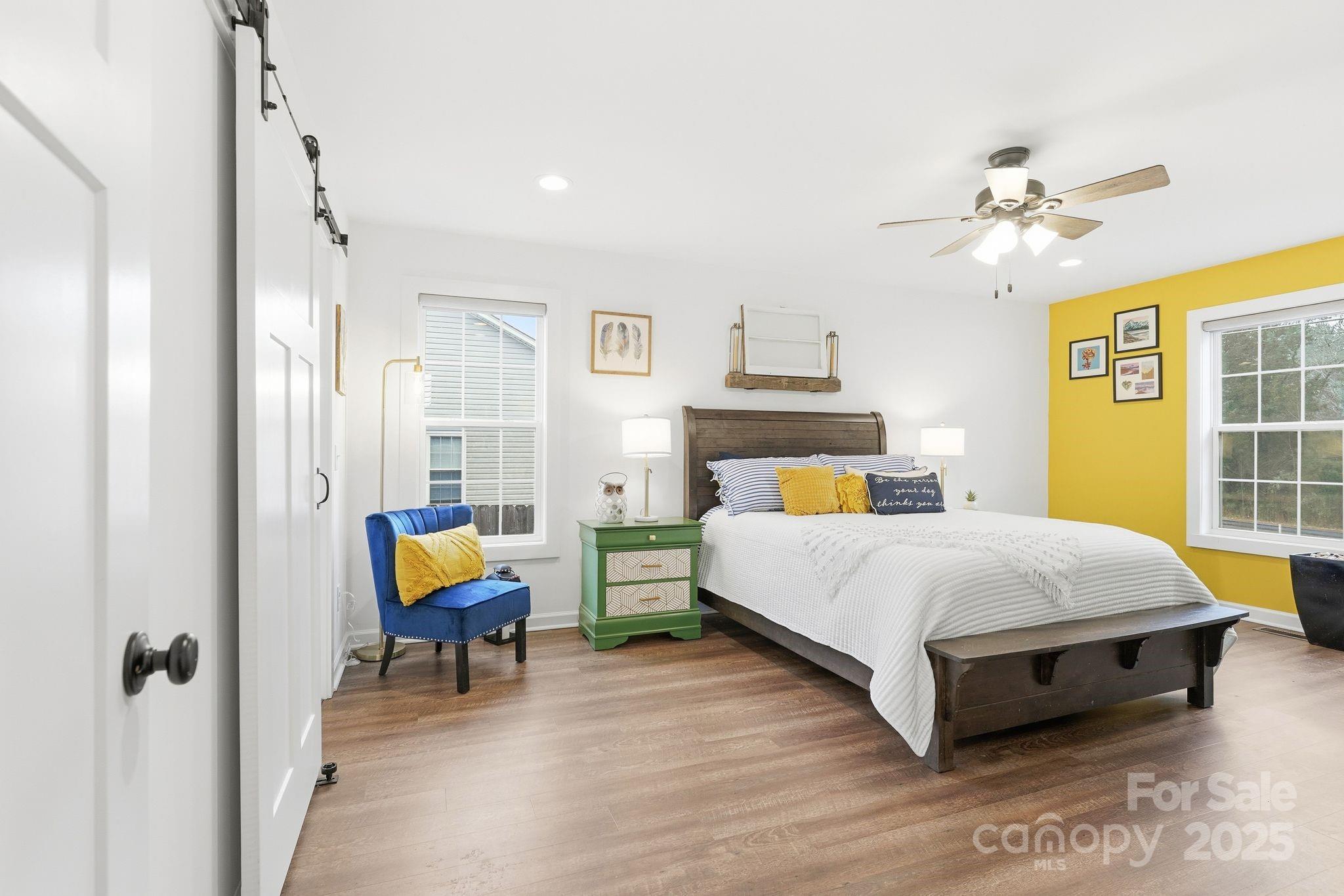 585 Stirewalt Road China Grove, NC 28023 - Photo 16 of 30 a bed room with a bed and a chandelier