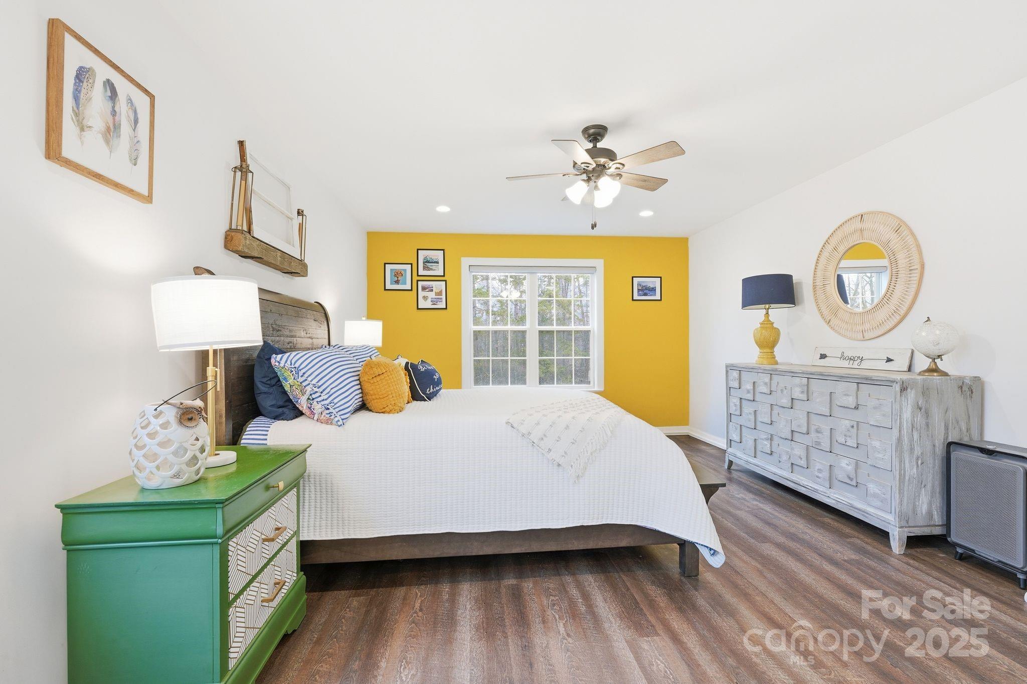 585 Stirewalt Road China Grove, NC 28023 - Photo 17 of 30 a bedroom with a bed a dresser with mirror