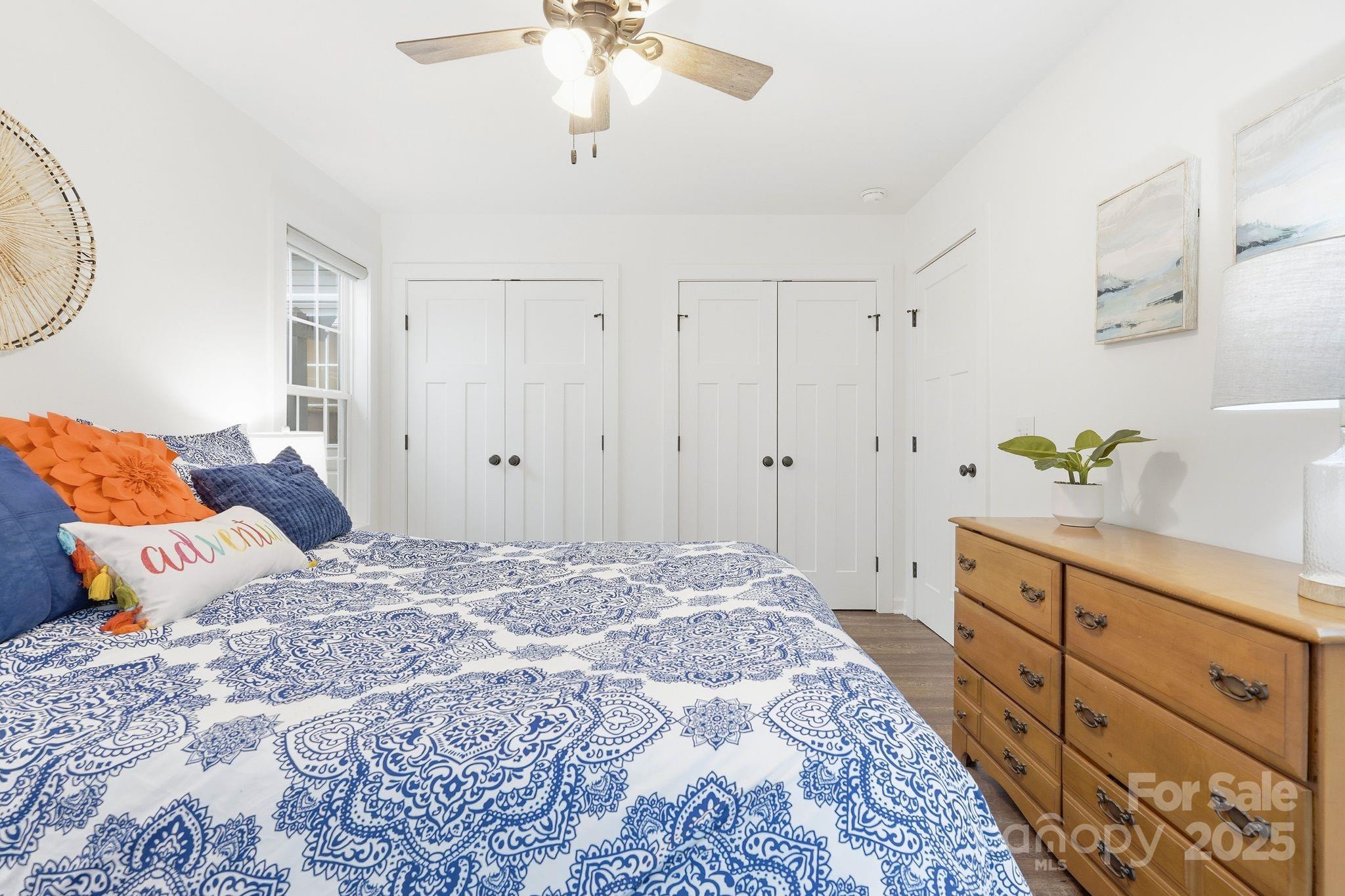 585 Stirewalt Road China Grove, NC 28023 - Photo 25 of 30 a bedroom with a bed and a chandelier