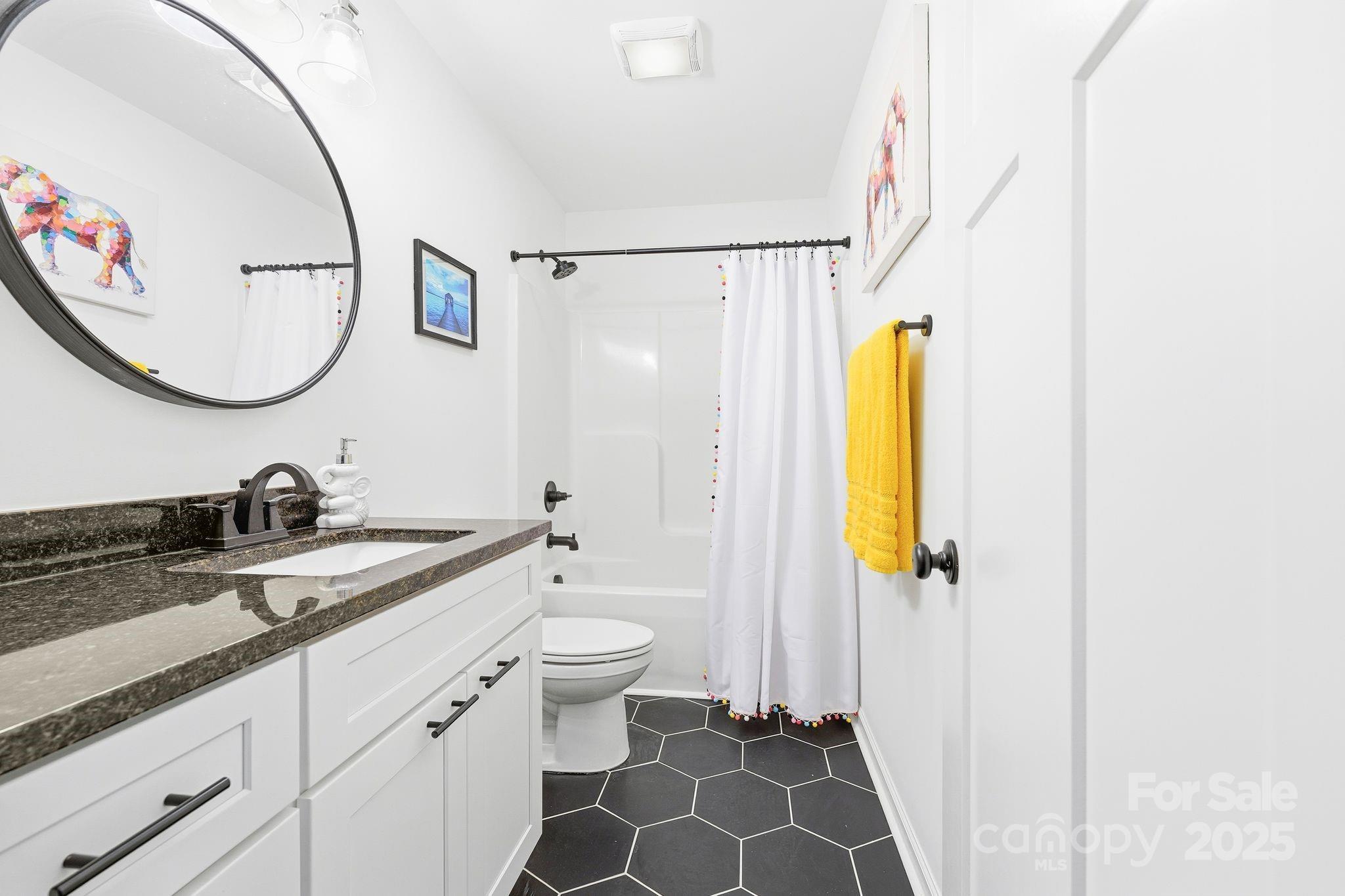 585 Stirewalt Road China Grove, NC 28023 - Photo 26 of 30 a bathroom with a granite countertop sink and a mirror