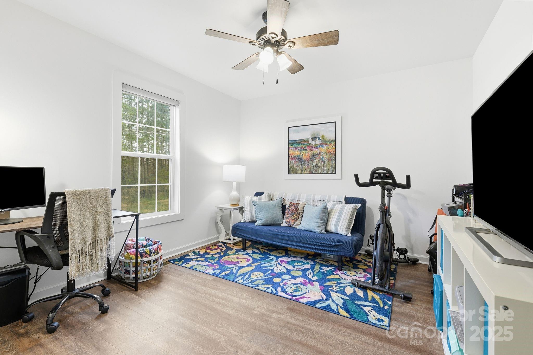585 Stirewalt Road China Grove, NC 28023 - Photo 28 of 30 a bedroom with furniture a bed and a flat screen tv