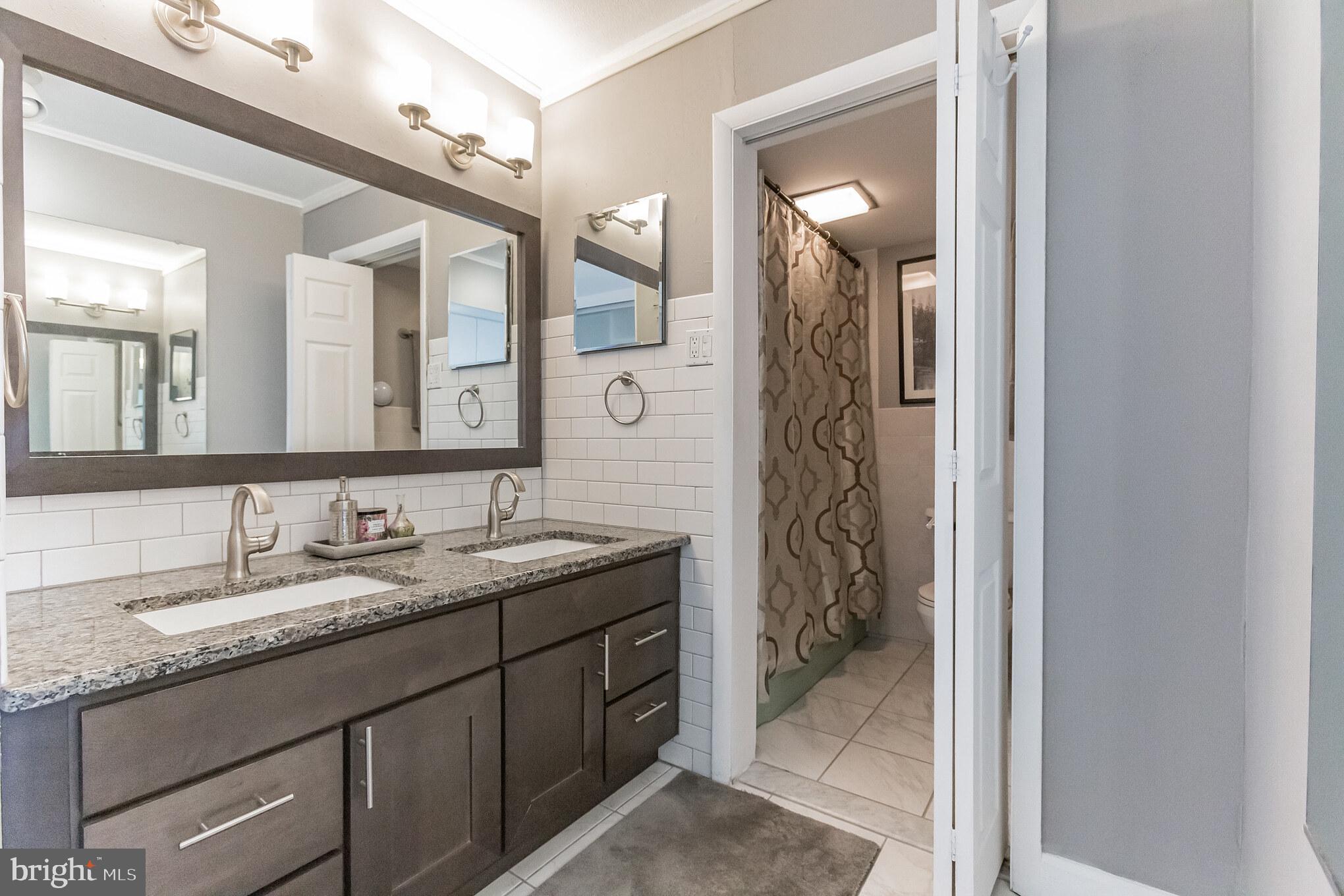 3900 West Ford Road, Unit 20M Philadelphia, PA 19131 - Photo 20 of 29 Upgraded Vanity Area w/ his/hers sinks