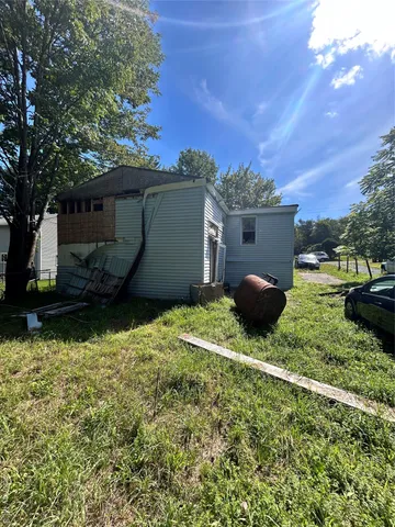 a backyard of a house with barbeque oven fire pit and outdoor seating