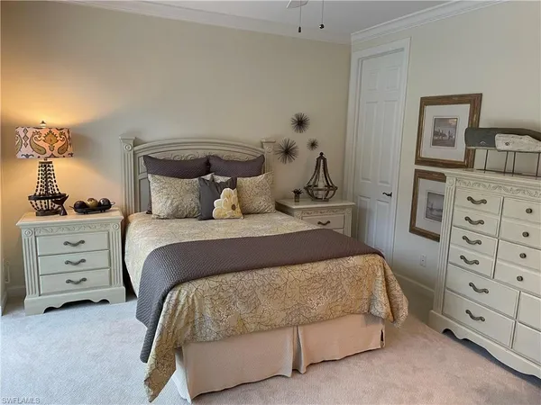 a bedroom with a bed and a closet