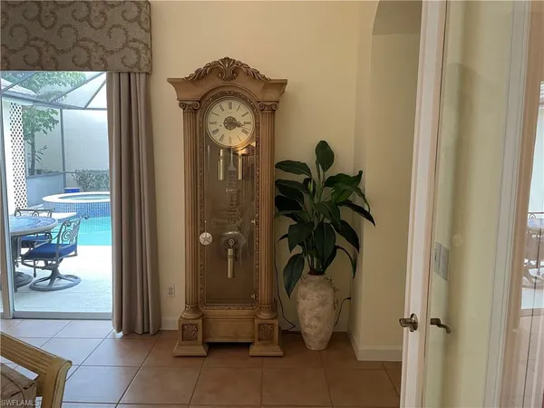a view of entryway with livingroom and flower pot