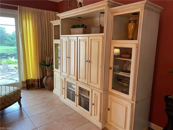 a view of walk in closet with large windows