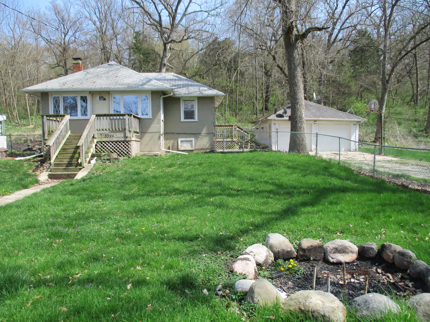 3344 East 2059th Road Ottawa, IL 61350 - Photo 1 of 17 a view of a house with backyard sitting area and garden