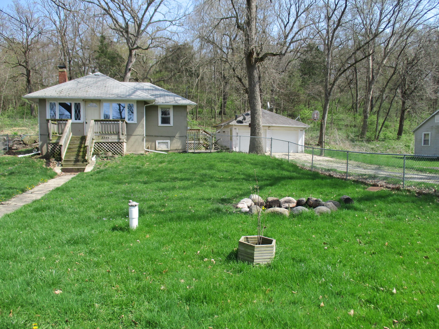 3344 East 2059th Road Ottawa, IL 61350 - Photo 3 of 17 a view of a house with backyard sitting area and garden