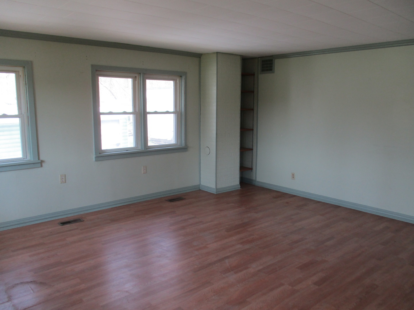 3344 East 2059th Road Ottawa, IL 61350 - Photo 6 of 17 an empty room with wooden floor and windows