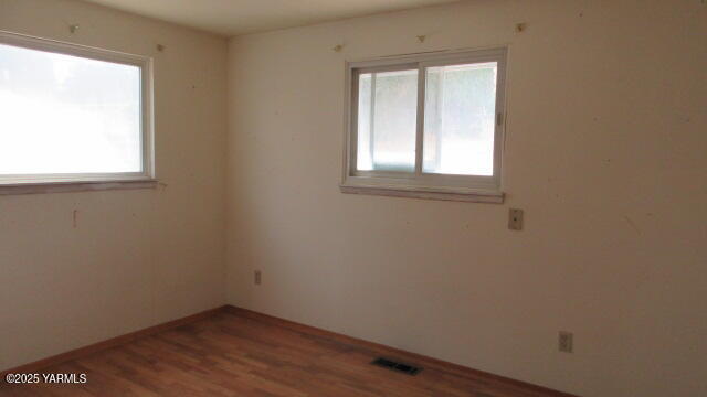 1116 Meadowbrook Road Yakima, WA 98903 - Photo 23 of 23 a view of a small space with wooden floor and a window