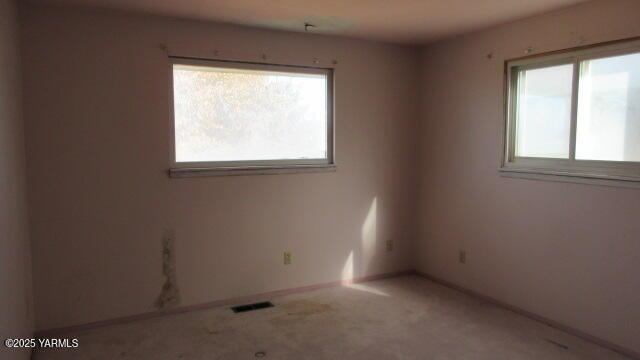1116 Meadowbrook Road Yakima, WA 98903 - Photo 4 of 23 an empty room with a window