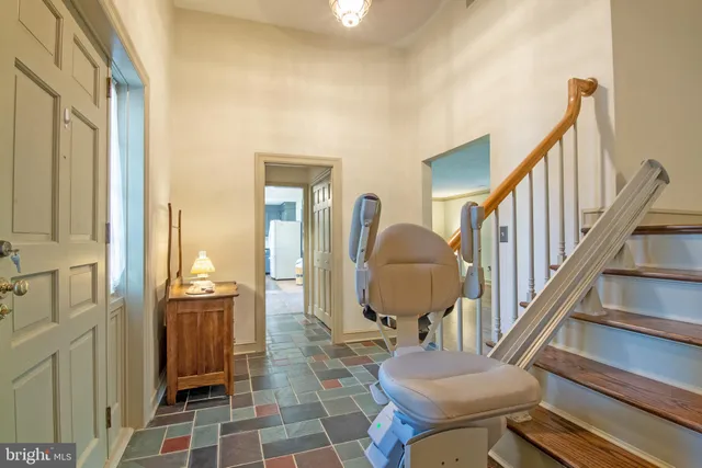 a kitchen with a sink refrigerator and cabinets