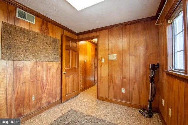 a bathroom with a sink toilet and window