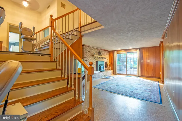 a view of an entryway with wooden floor