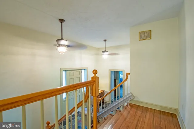 an empty room with wooden floor