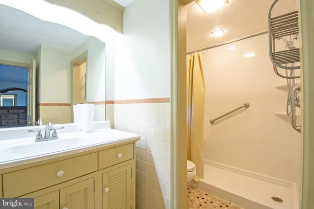 a view of room with window and wooden floor