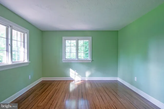 a bathroom with a sink toilet and mirror