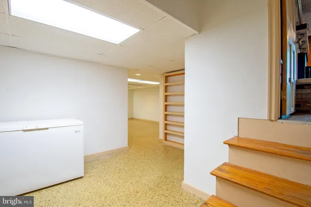 a room with chairs and table