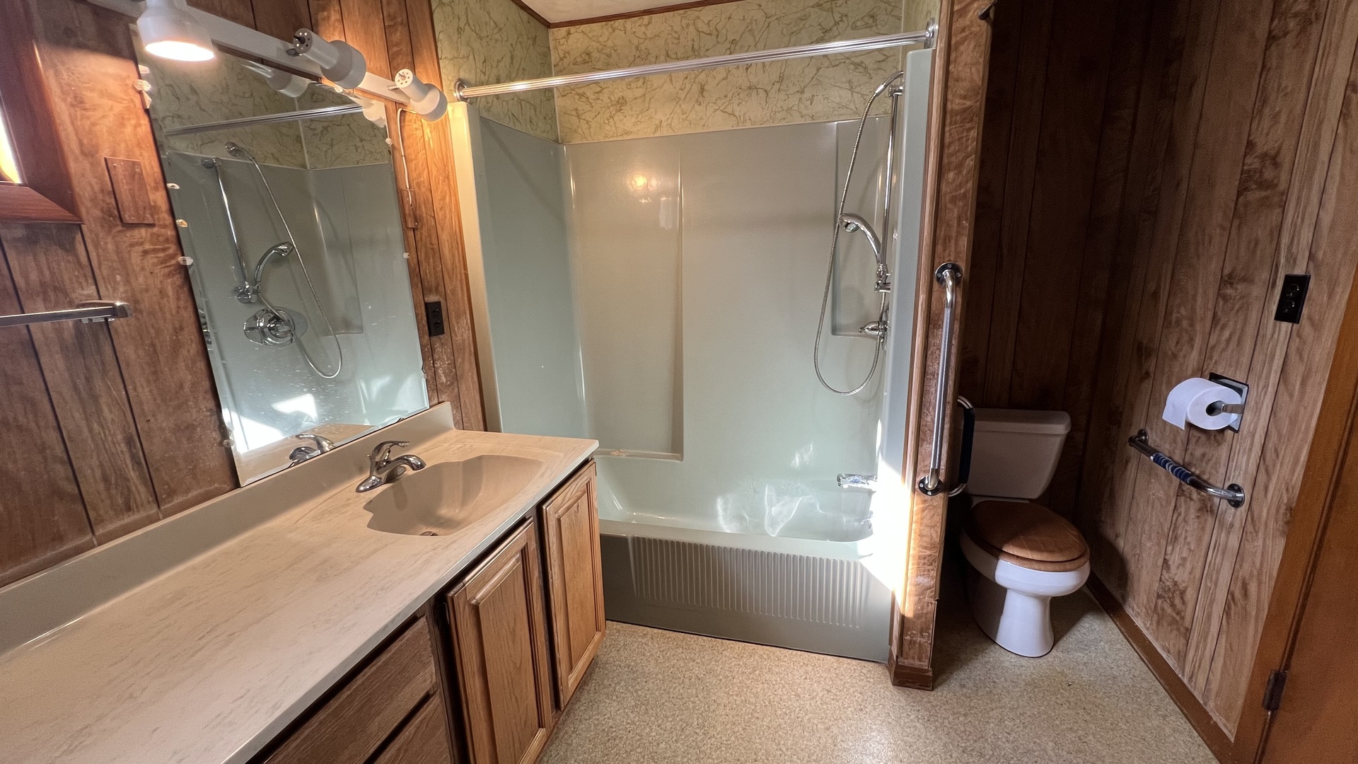 113 West Delaware Street Dwight, IL 60420 - Photo 13 of 21 a bathroom with a sink toilet and shower