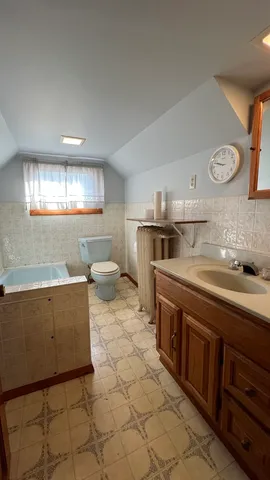 a kitchen with stainless steel appliances a stove a sink a refrigerator and cabinets