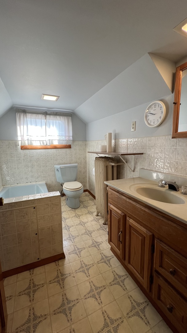 113 West Delaware Street Dwight, IL 60420 - Photo 14 of 21 a kitchen with stainless steel appliances a stove a sink a refrigerator and cabinets