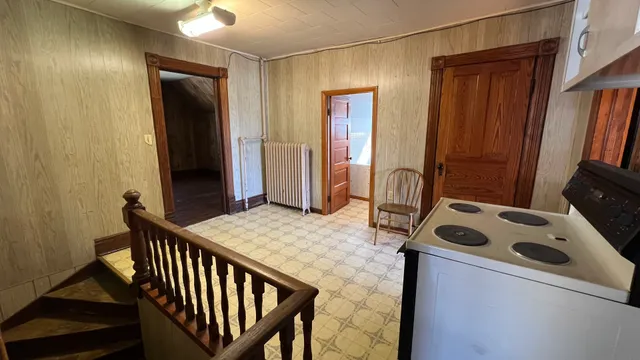 a view of livingroom with furniture and front door