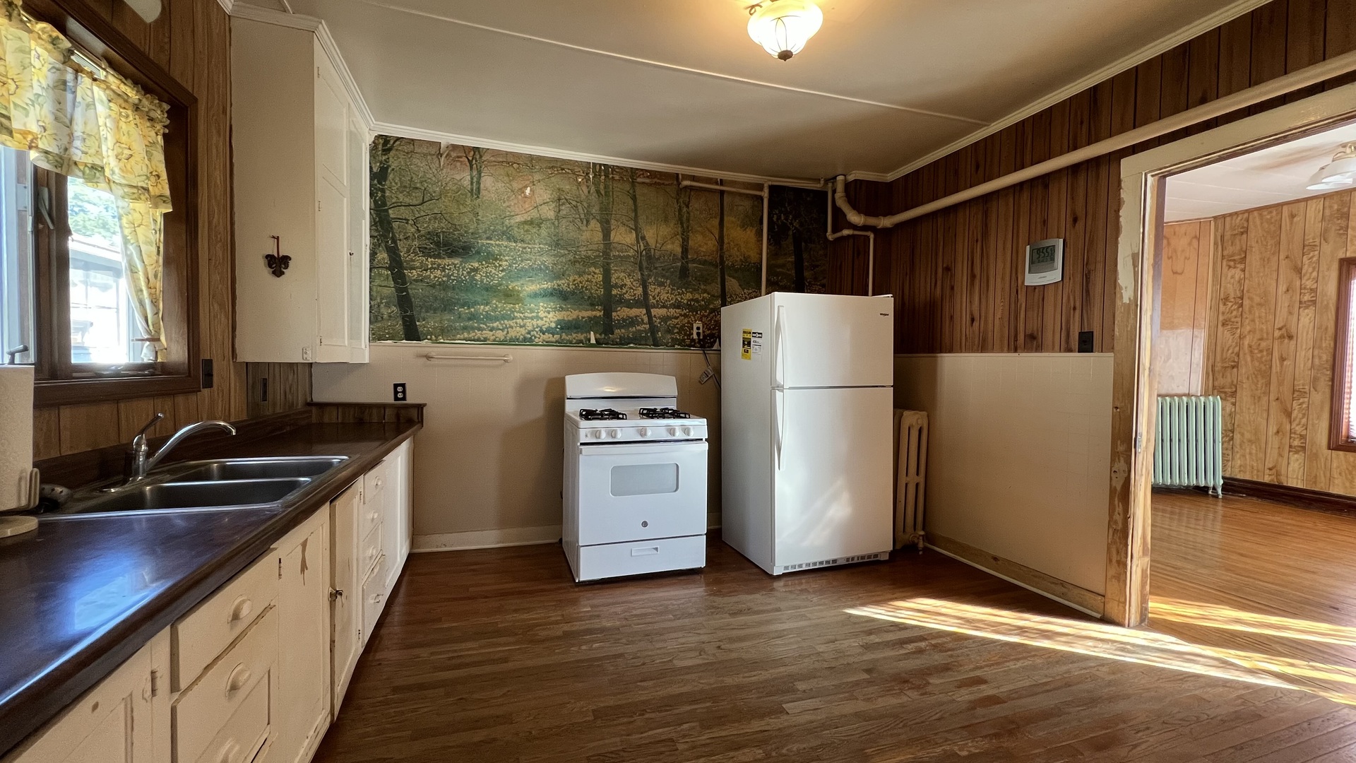 113 West Delaware Street Dwight, IL 60420 - Photo 3 of 21 a kitchen with refrigerator a stove and a sink