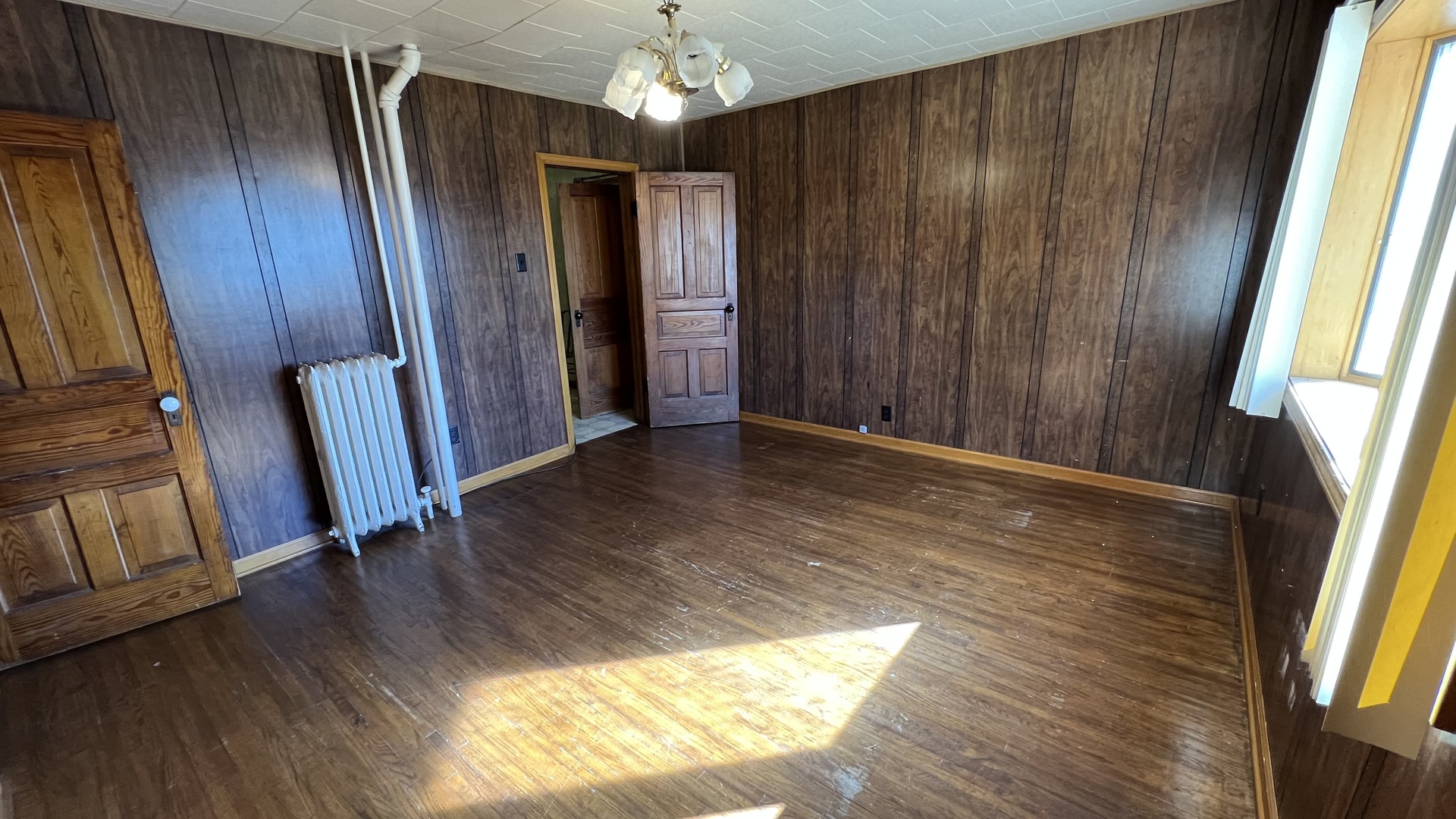 113 West Delaware Street Dwight, IL 60420 - Photo 10 of 21 a view of an entryway with wooden floor and door