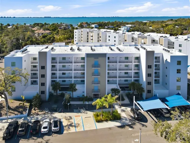 a view of a patio with table and chairs and potted plants