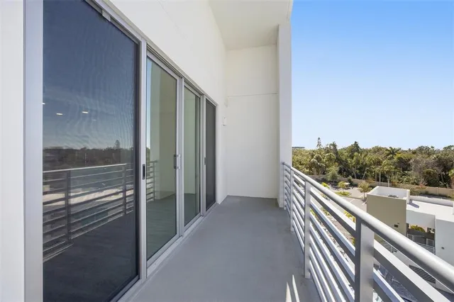 a view of balcony with furniture