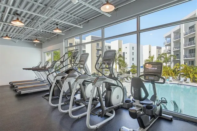 a view of a swimming pool with outdoor seating