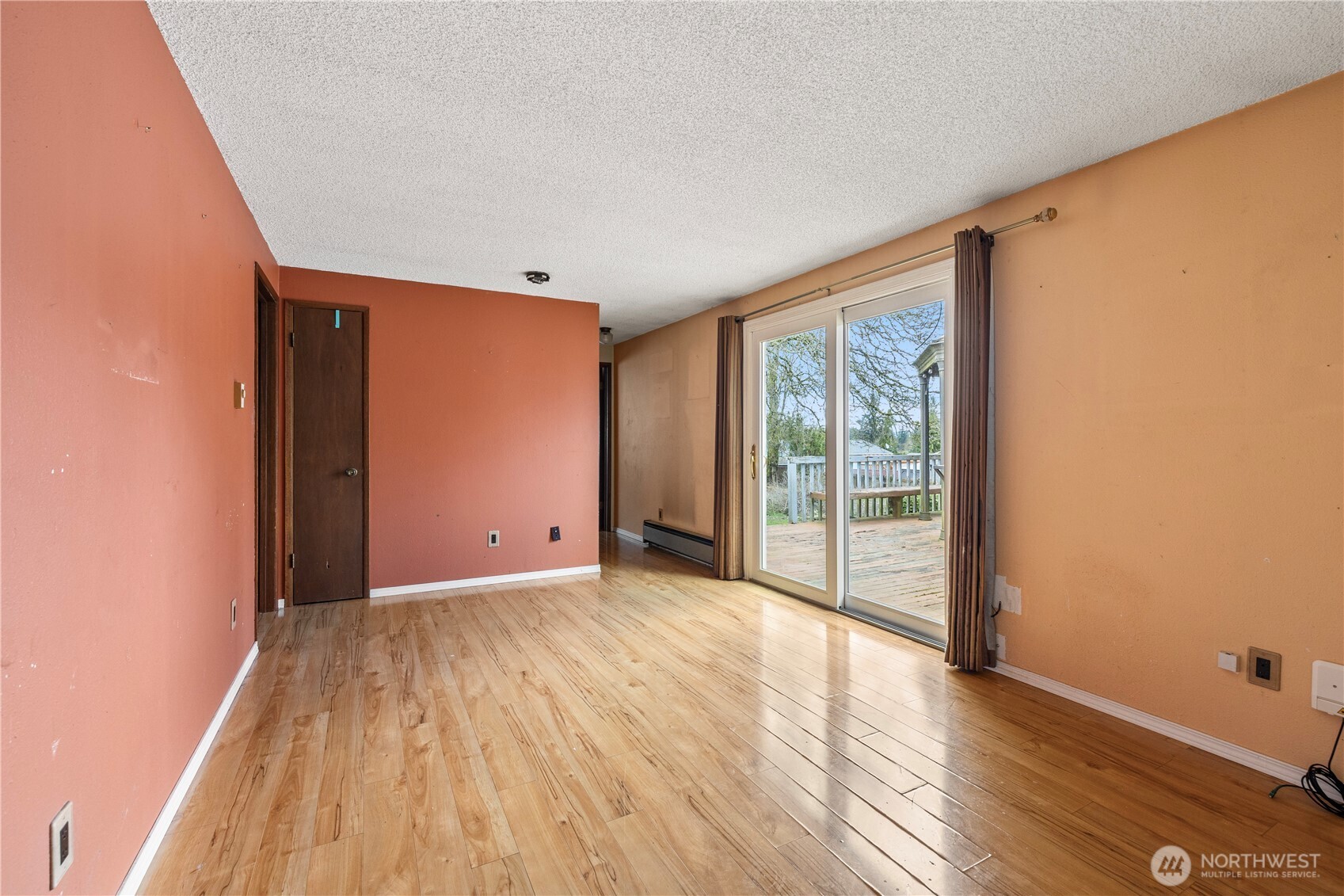 15 76th Street Southwest Everett, WA 98203 - Photo 16 of 39 a view of an empty room with wooden floor and a window