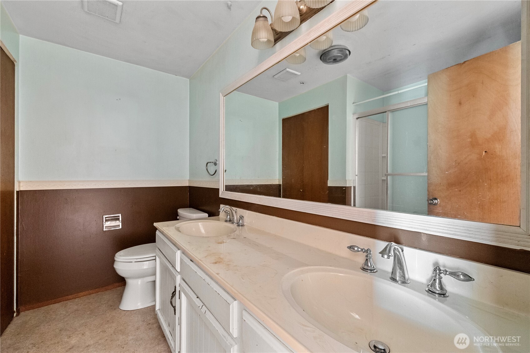 15 76th Street Southwest Everett, WA 98203 - Photo 18 of 39 a bathroom with a sink a toilet and a mirror