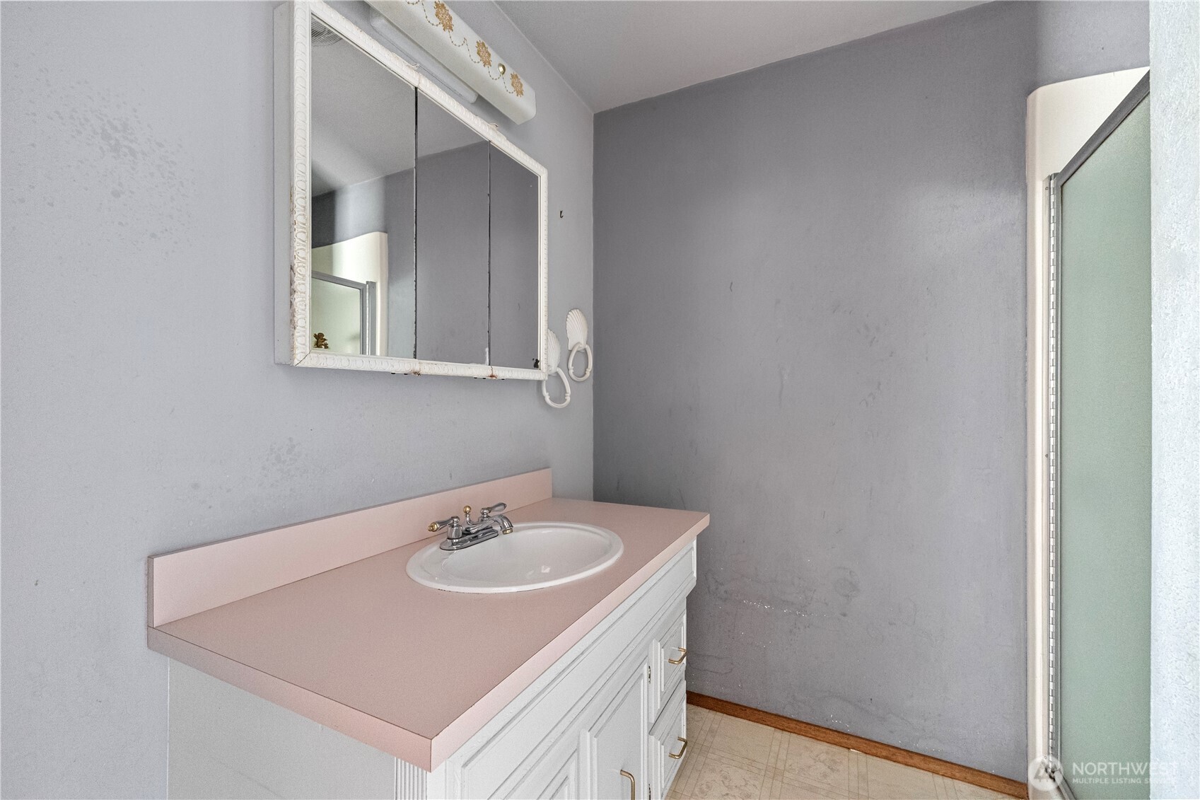 15 76th Street Southwest Everett, WA 98203 - Photo 19 of 39 a bathroom with a sink and a mirror