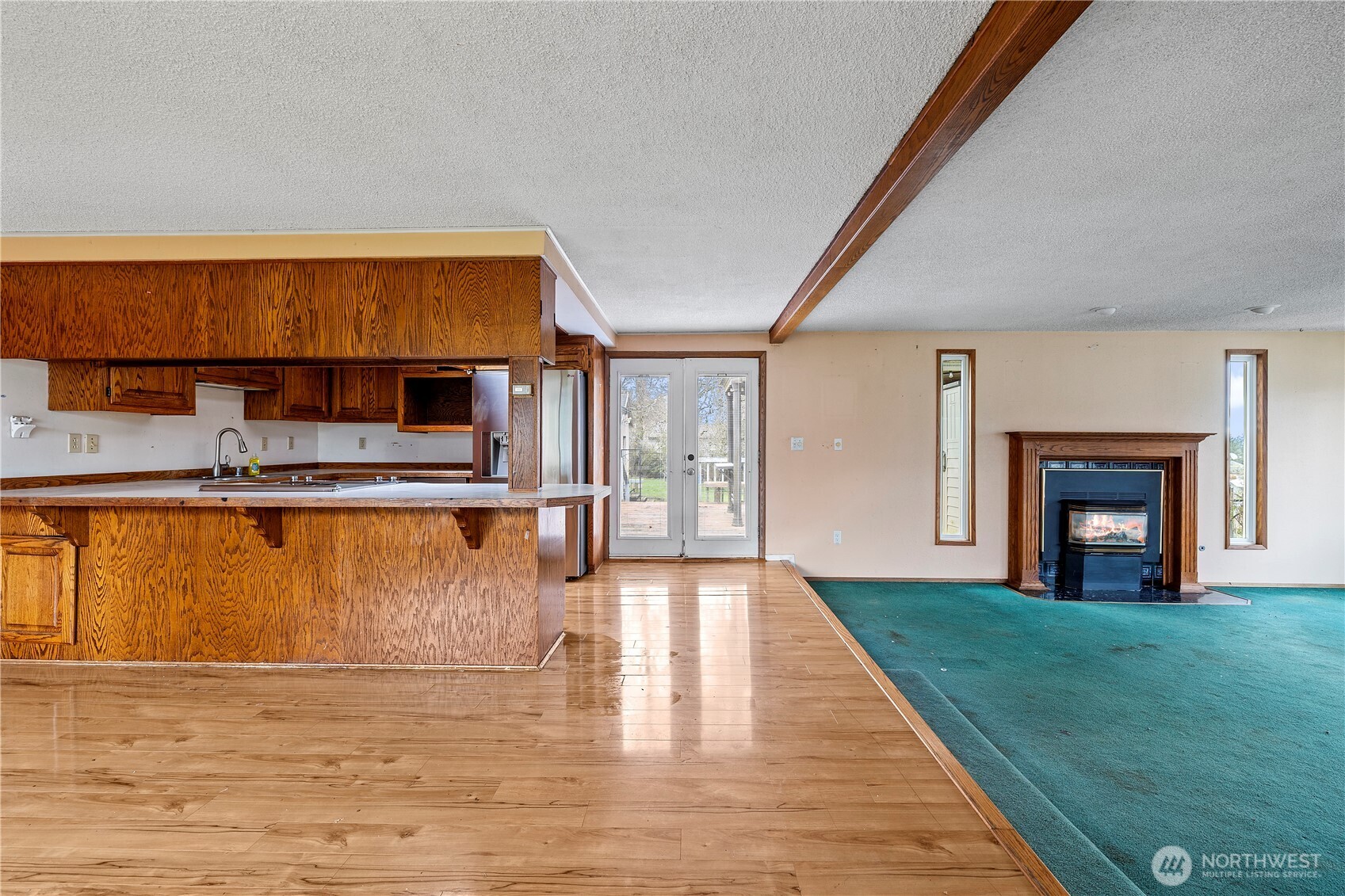 15 76th Street Southwest Everett, WA 98203 - Photo 20 of 39 a view of an empty room with a fireplace and a window