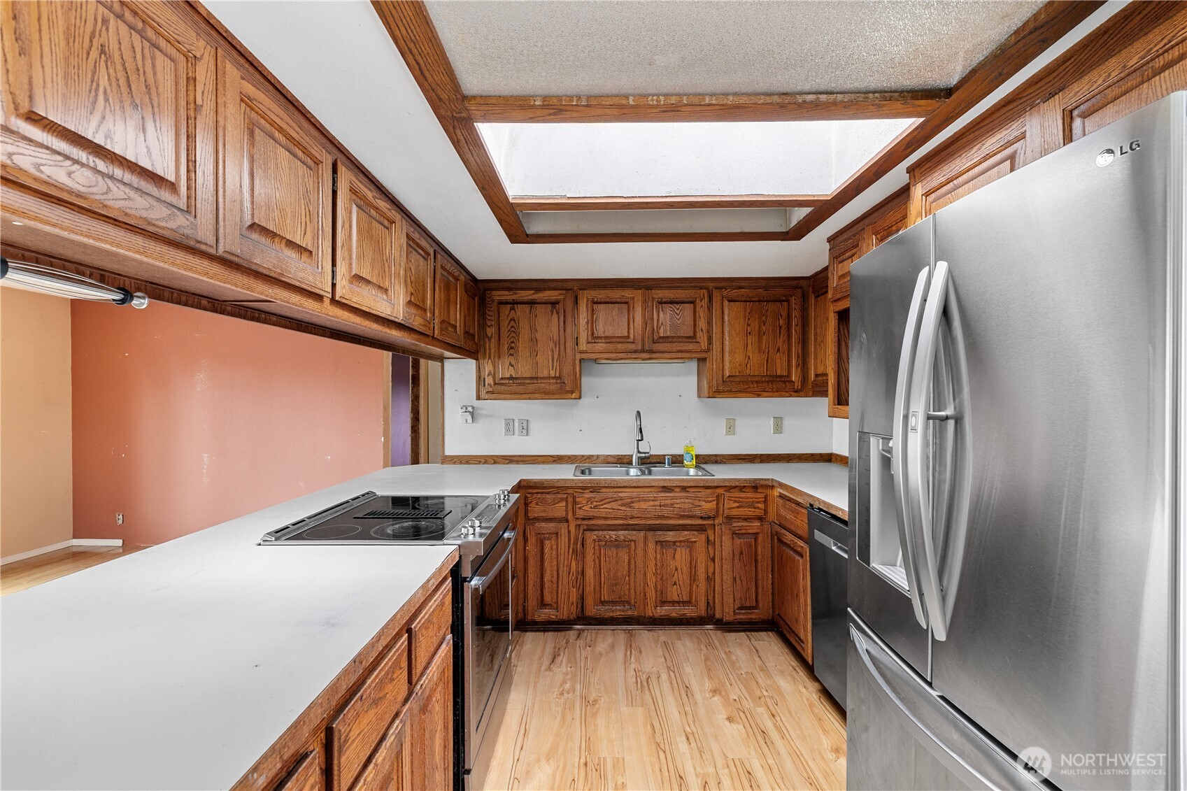 15 76th Street Southwest Everett, WA 98203 - Photo 23 of 39 a kitchen with stainless steel appliances granite countertop a sink refrigerator and cabinets