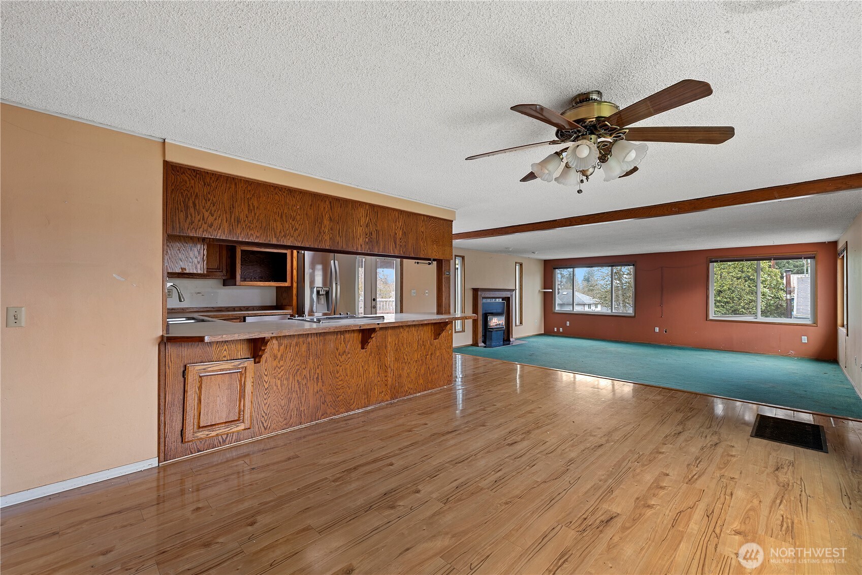 15 76th Street Southwest Everett, WA 98203 - Photo 3 of 39 a view of a kitchen with a sink and dishwasher with wooden floor