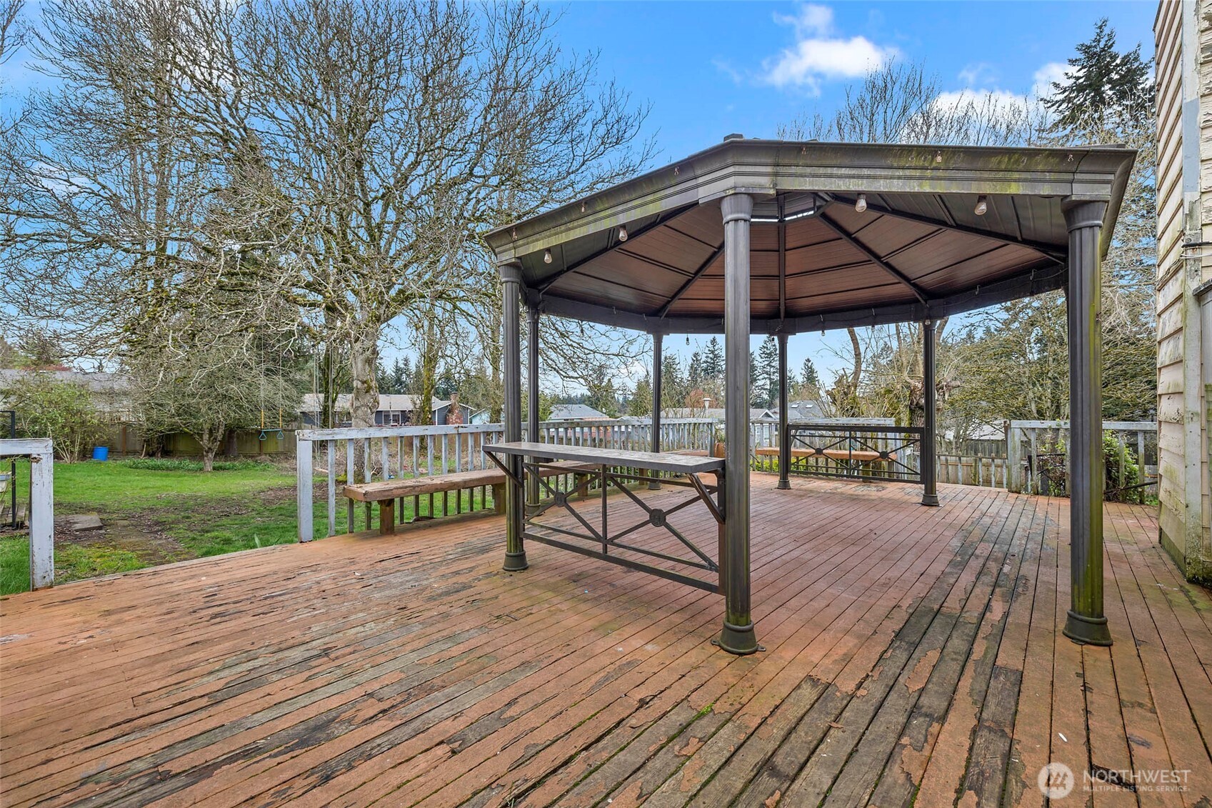 15 76th Street Southwest Everett, WA 98203 - Photo 31 of 39 a view of a deck with wooden floor and roof with a garden view