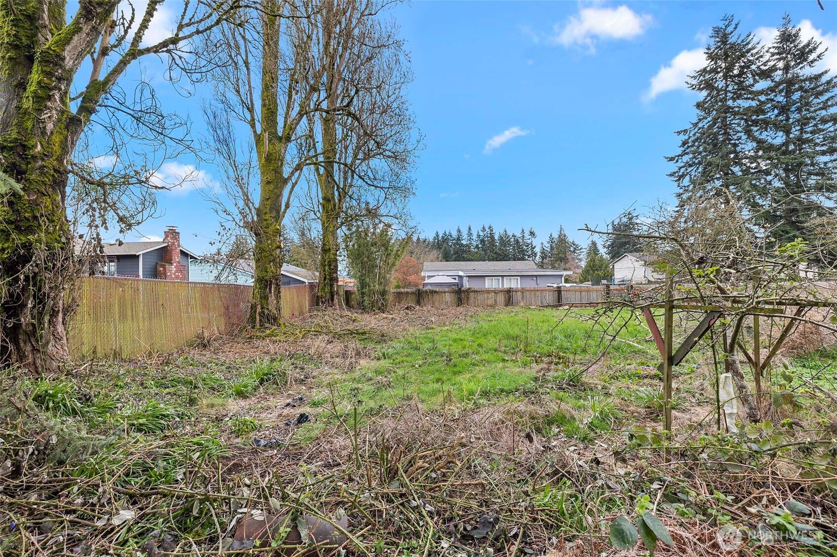 15 76th Street Southwest Everett, WA 98203 - Photo 36 of 39 a view of backyard with table and chairs and wooden fence